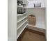 Walk-in pantry features white shelves, hardwood floors and ample storage space at 7801 N 4Th Pl, Phoenix, AZ 85020