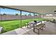 Covered patio featuring sleek outdoor furniture and a view of the lush green lawn, perfect for relaxing and entertaining at 7801 N 4Th Pl, Phoenix, AZ 85020