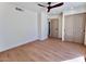 Bright bedroom with hardwood floors, a ceiling fan, and closet provides a peaceful retreat at 7955 E Chaparral Rd # 34, Scottsdale, AZ 85250