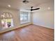 An expansive bedroom with hard wood flooring and large windows offering plenty of natural lighting at 7955 E Chaparral Rd # 34, Scottsdale, AZ 85250