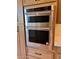 A modern stainless steel KitchenAid microwave and oven combination are built into the cabinets at 7955 E Chaparral Rd # 34, Scottsdale, AZ 85250
