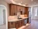 This modern kitchen features wood cabinets, stainless steel appliances, and marble countertops at 7955 E Chaparral Rd # 34, Scottsdale, AZ 85250