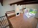 A bright living room with wood floors, built-in cabinets, fireplace and sliding doors to the patio at 7955 E Chaparral Rd # 34, Scottsdale, AZ 85250