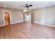 Spacious main bedroom featuring hardwood floors, a ceiling fan, and access to the en-suite bathroom at 7955 E Chaparral Rd # 34, Scottsdale, AZ 85250