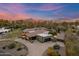 Aerial view of luxury home with mountain views, lush desert landscaping, and driveway at 8724 N 68Th St, Paradise Valley, AZ 85253