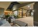 An outdoor seating area with a view into the home through large windows, and desert landscaping nearby at 8724 N 68Th St, Paradise Valley, AZ 85253