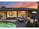 Inviting backyard pool area featuring lounge chairs, desert plants, and serene ambiance at twilight at 8724 N 68Th St, Paradise Valley, AZ 85253