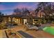 Beautiful outdoor space with pool, lounge chairs, cacti, and covered patio at dusk at 8724 N 68Th St, Paradise Valley, AZ 85253
