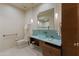 Modern bathroom with vessel sink, custom vanity, and decorative mirror at 8724 N 68Th St, Paradise Valley, AZ 85253
