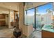 Bathroom featuring stone floors, custom vanities, and outdoor shower at 8724 N 68Th St, Paradise Valley, AZ 85253
