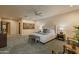 Large, carpeted primary bedroom with a king bed and stylish furnishings at 8724 N 68Th St, Paradise Valley, AZ 85253