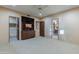 Spacious bedroom featuring neutral colors, carpet, and built-in media center with shelves and drawers at 8724 N 68Th St, Paradise Valley, AZ 85253