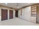 Serene bedroom with a built-in Murphy bed, carpet floors, closet doors, and natural light for rest and relaxation at 8724 N 68Th St, Paradise Valley, AZ 85253