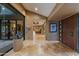 Spacious foyer boasting herringbone wood floors, artwork, and an open view into the living spaces at 8724 N 68Th St, Paradise Valley, AZ 85253