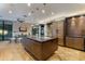 Open kitchen with island and stainless steel appliances, modern wood cabinets, and a breakfast nook at 8724 N 68Th St, Paradise Valley, AZ 85253