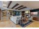 Cozy living room with beamed ceilings, fireplace, comfortable seating, and stylish decor at 8724 N 68Th St, Paradise Valley, AZ 85253