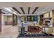Inviting living room with beamed ceilings, fireplace, comfortable seating, and stylish area rug at 8724 N 68Th St, Paradise Valley, AZ 85253