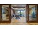 Spacious office featuring built-in shelving, a large window with a view, and herringbone wood floors at 8724 N 68Th St, Paradise Valley, AZ 85253