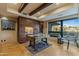 Bright home office featuring custom built-ins, detailed desk, large windows, and unique wood flooring at 8724 N 68Th St, Paradise Valley, AZ 85253