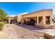 Serene backyard with patio seating, vibrant desert landscaping, and beautiful architectural details at 8850 W Piute Ave, Peoria, AZ 85382