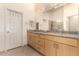 Bright bathroom boasts granite counters, modern fixtures, and convenient walk-in shower at 8850 W Piute Ave, Peoria, AZ 85382