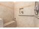 Accessible bathroom and shower featuring grab bars and ceramic tile at 8850 W Piute Ave, Peoria, AZ 85382
