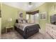 Cozy bedroom with warm colors, carpet, and natural lighting, ideal for relaxation at 8850 W Piute Ave, Peoria, AZ 85382