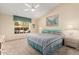 Bright bedroom with a ceiling fan, carpet, and a large window with a view of the backyard at 8850 W Piute Ave, Peoria, AZ 85382