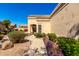 Beautiful front entrance with desert landscaping and a winding sidewalk at 8850 W Piute Ave, Peoria, AZ 85382