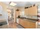 Bright eat-in kitchen featuring wood floors, granite counters, and modern appliances at 8850 W Piute Ave, Peoria, AZ 85382