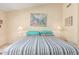 Close up on the primary bed that has matching lamps on each nightstand at 8850 W Piute Ave, Peoria, AZ 85382