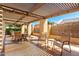 Charming outdoor patio with a shaded pergola, offering a delightful space for relaxation and enjoyment at 8850 W Piute Ave, Peoria, AZ 85382