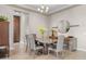 Modern dining room featuring sleek furniture, contemporary decor, and tile floors at 10431 E Tiger Lily Ave, Mesa, AZ 85212