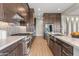 Modern kitchen with stainless steel appliances, stone countertops, and ample cabinet space at 10431 E Tiger Lily Ave, Mesa, AZ 85212