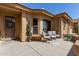 Inviting front porch with comfortable seating to enjoy the beautiful Arizona weather at 11062 E Ocaso Ave, Mesa, AZ 85212