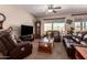 Relaxing living room featuring comfortable seating and natural light at 11062 E Ocaso Ave, Mesa, AZ 85212