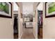 Bright main bedroom featuring walk-in closets, a ceiling fan, neutral carpeting, and shuttered windows for natural light at 11062 E Ocaso Ave, Mesa, AZ 85212