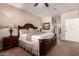 Spacious main bedroom featuring a ceiling fan and carpet flooring at 11062 E Ocaso Ave, Mesa, AZ 85212