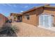 Well-maintained backyard featuring a covered patio and a storage shed, perfect for outdoor living and storage at 11121 E Onza Ave, Mesa, AZ 85212