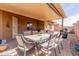 Inviting covered patio featuring a dining table and chairs, perfect for outdoor meals and gatherings at 11121 E Onza Ave, Mesa, AZ 85212