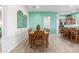 Dining room with large table and stylish decorative window decor at 11121 E Onza Ave, Mesa, AZ 85212