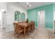 Dining room with a long wooden table and decorative window decor at 11121 E Onza Ave, Mesa, AZ 85212