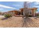 Attractive single-story home featuring desert landscaping and a charming front porch at 11121 E Onza Ave, Mesa, AZ 85212