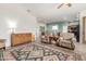 Open living area showcasing neutral decor, colorful rug and comfortable seating arrangement at 11121 E Onza Ave, Mesa, AZ 85212