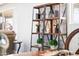 Living room view of a shelf decorated with plants, lanterns, and books for an inviting ambiance at 11446 W Hidalgo Ave, Tolleson, AZ 85353