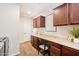 Functional laundry room features modern units, ample cabinet space, and a built-in workstation with stylish decor at 12708 W Auburn Dr, Peoria, AZ 85383