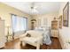 Cozy bedroom with wood floors, ceiling fan, and decorative shelving at 15385 W Indianola Ave, Goodyear, AZ 85395