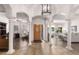 Grand foyer with columns, tile, and wood floors, with great natural light at 15385 W Indianola Ave, Goodyear, AZ 85395