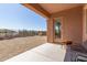 Covered back patio with desert landscaping and a view of the surrounding neighborhood at 17743 W Verdin Rd, Goodyear, AZ 85338