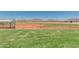 Baseball field features lush green grass, with mountain views at 17743 W Verdin Rd, Goodyear, AZ 85338